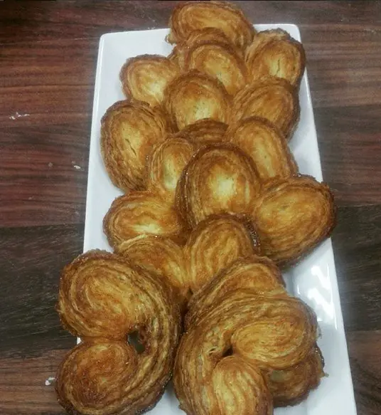 Golden palm-shaped pastries showing distinct caramelised puff-pastry layers